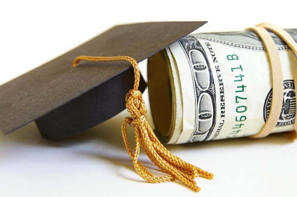 A graduation cap with a rolled-up money scroll tied | Bankruptcy Lawyer | Natural State Law, PLLC